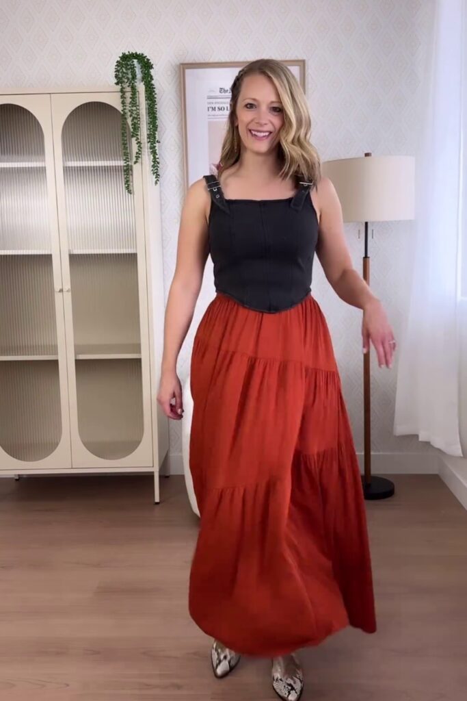 Black Sleeveless Top with Orange Tiered Maxi Skirt and Snakeskin Boots