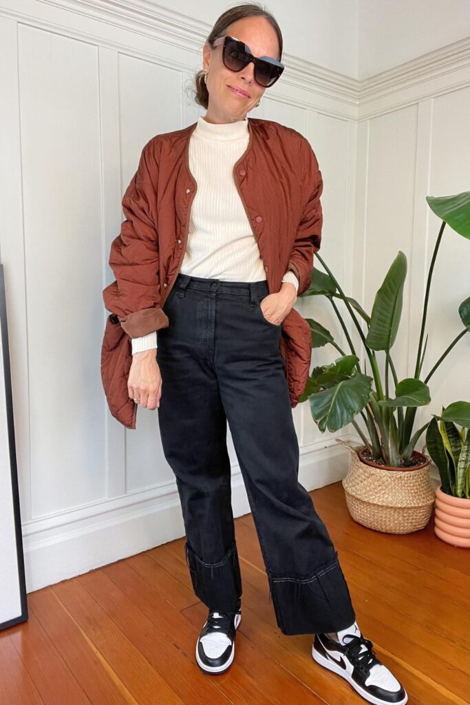 Puffer Jacket, Knit Sweater, High-Waisted Jeans, and Sneakers