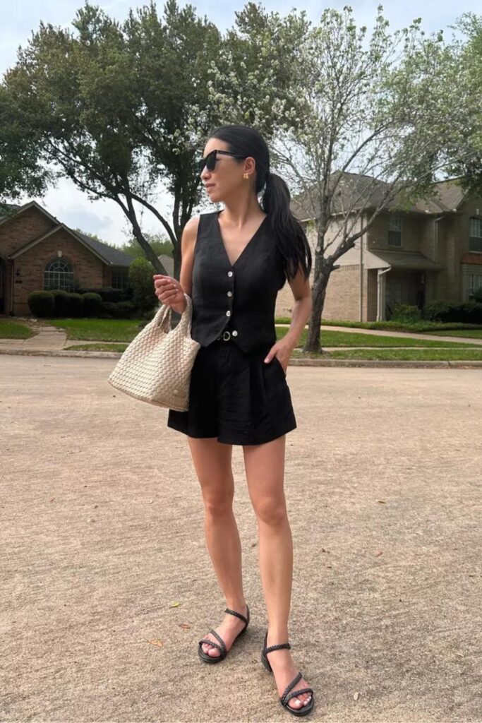 How to Style a Vest: Black Vest and Black Shorts