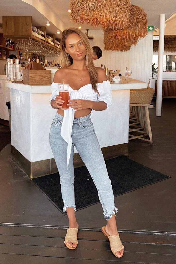 What to Wear to a Bar White Off-The-Shoulder Crop and Distressed Denim