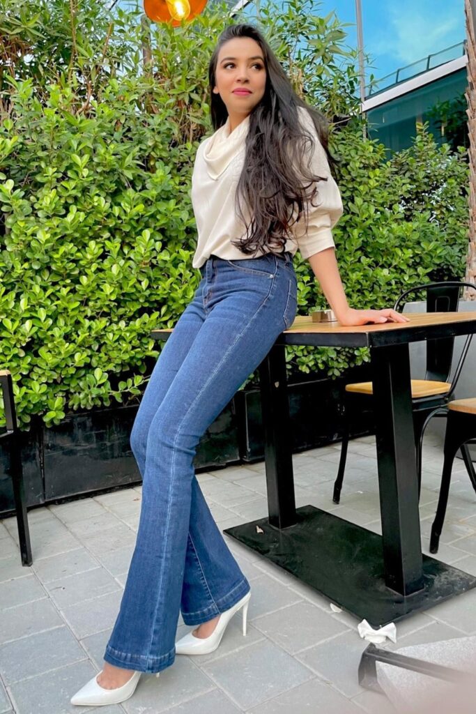 Jeans and Heels Outfit: Cowlneck Top, Jeans & White Pumps