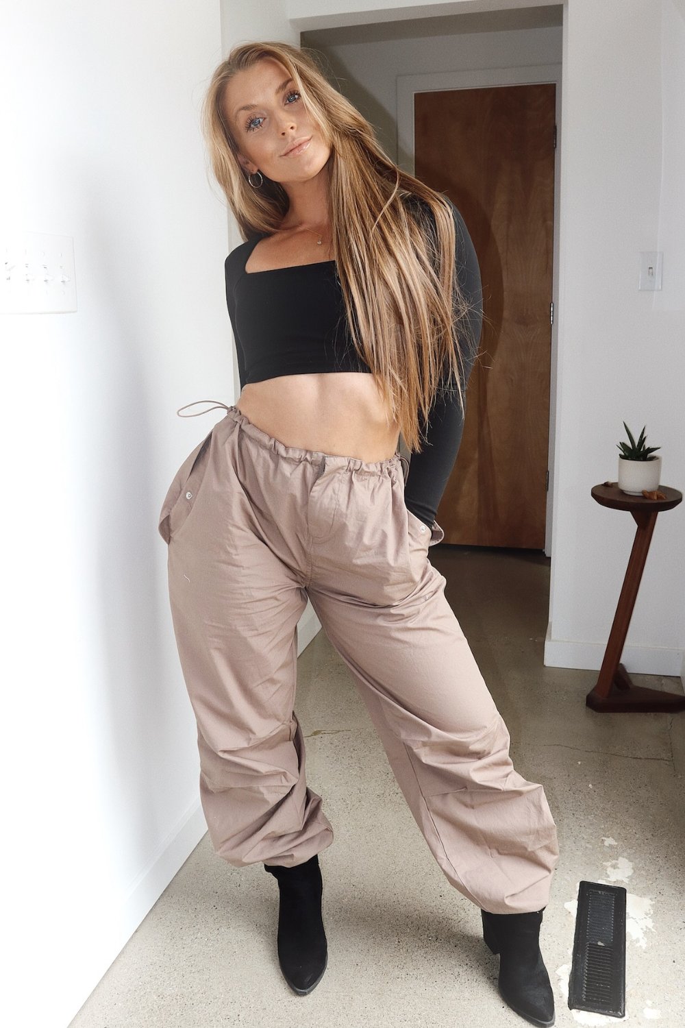 Black Long Sleeve Crop Top and Beige Pants